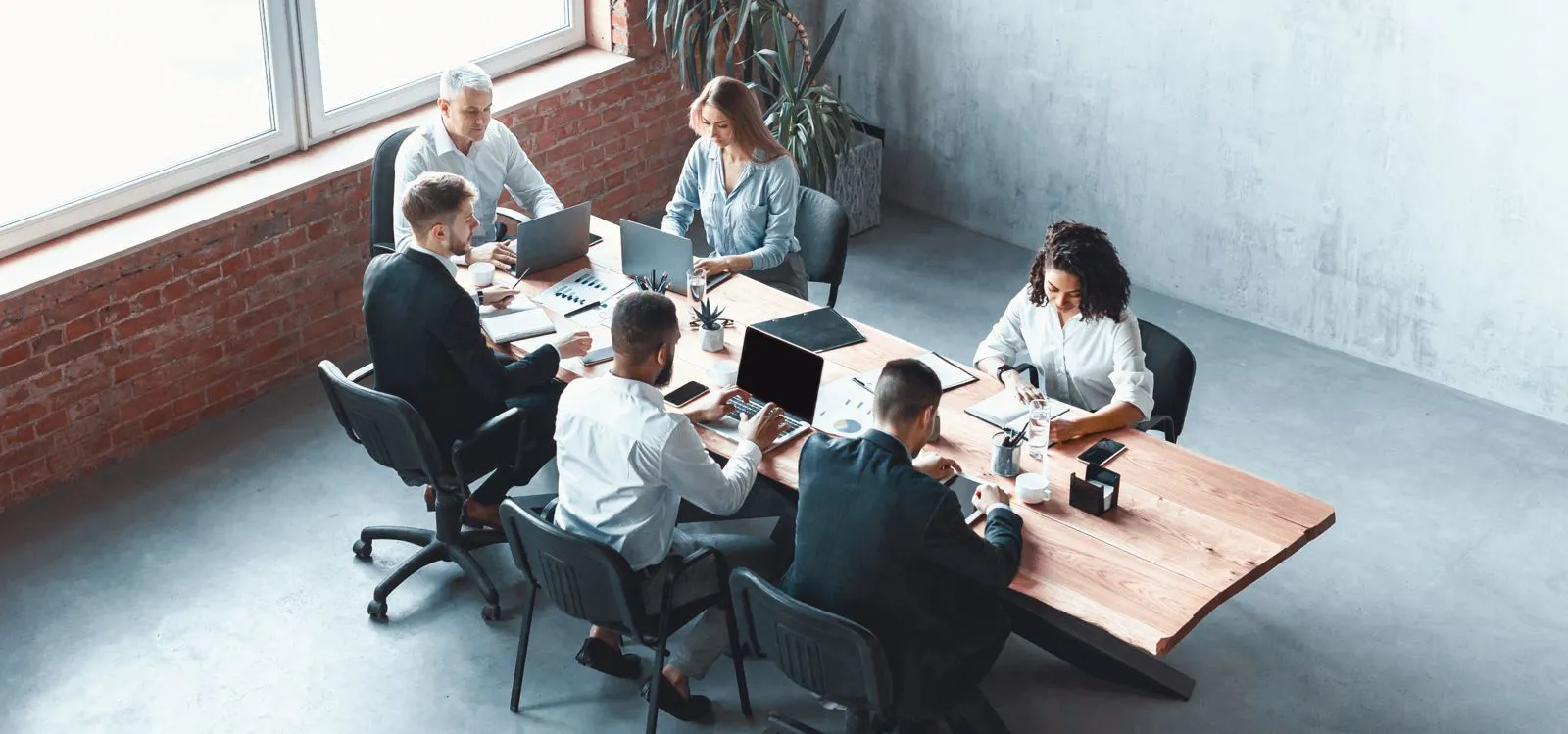 Multi-ethnic business team working together sitting